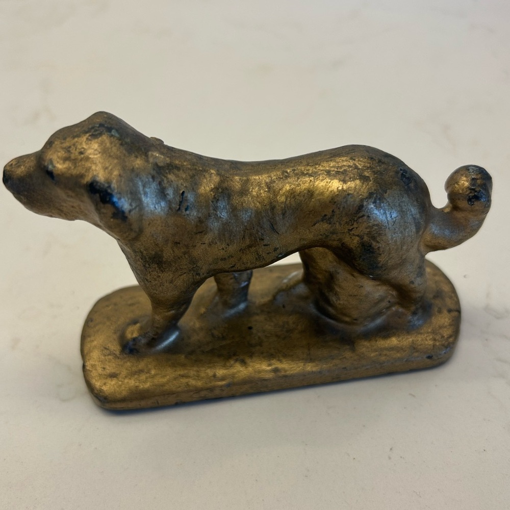 Antique cast iron dog figurine likely from the early 1900s . Found Quebec